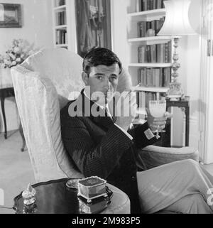 Advertisement for Life cigarettes -- male model (Peter Anthony) posing in a luxury interior. Stock Photo