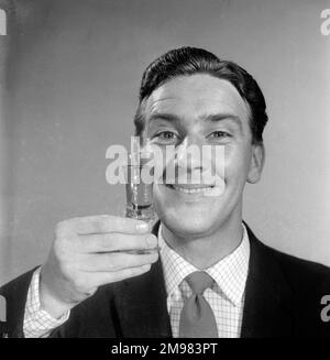 Advertisement for Emu sherry -- smiling male model (Stanley Morgan) holding up a glass. Stock Photo