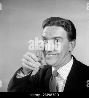 Advertisement for Emu sherry -- smiling male model (Stanley Morgan) holding up a glass. Stock Photo