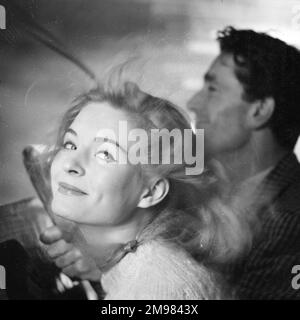 Advertisement for beauty products -- male and female models (D Orme and M Colbrook) posing in a car. Stock Photo