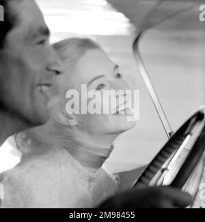 Advertisement for beauty products -- male and female models (D Orme and M Colbrook) posing in a car. Stock Photo