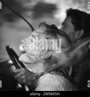 Advertisement for beauty products -- male and female models (D Orme and M Colbrook) posing in a car. Stock Photo