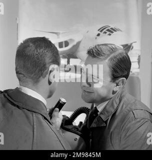 Advertisement for Silvikrin hair products -- two male models posing. Stock Photo