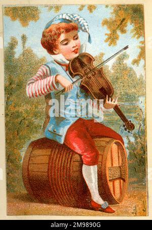 Victorian boy violinist sitting on a barrel. Stock Photo