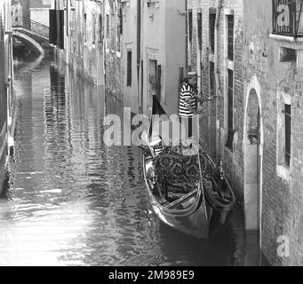 Gondolier in Venice, Italy. Stock Photo