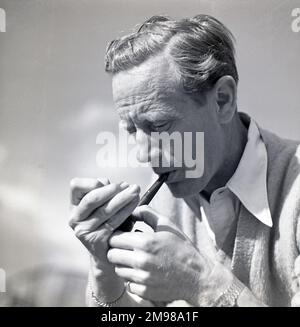 Leslie Howard (1893-1943) photographed on the film set for The First of the Few, in which he played the Spitfire designer RJ Mitchell. Stock Photo