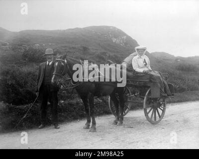 Horse and cart in County Donegal, north-west Ireland, on the road from Malin More (Malinmore) to Killybegs. Stock Photo