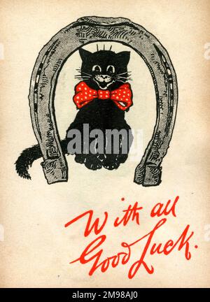 Good Luck card, black cat in a horseshoe. Stock Photo