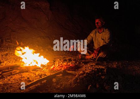 ZAGROS, IRAN - JULY 7, 2019: Nomad having chicken barbecue in Zagros mountains, Iran Stock Photo
