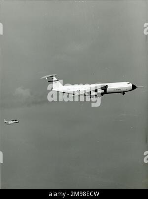 The first Lockheed C-5A Galaxy, 66-8303, with a Lockheed T-33 chase plane, during an early test flight. Stock Photo