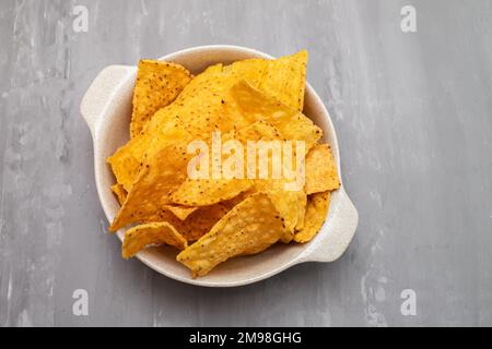 Few mexican nachos chips in small bowl Stock Photo