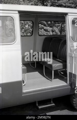 1957, historical, a side view of the inside of a Ford Thames 15 cwt 400E minibus or small people carrier, showing the basic seating set-up. The 400E van was a light commerical vehicle made in Dagenham, Britain by Ford UK from 1957 to 1965. Stock Photo