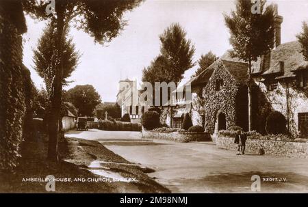 House and St Michael's Church in Amberley, West Sussex. Stock Photo