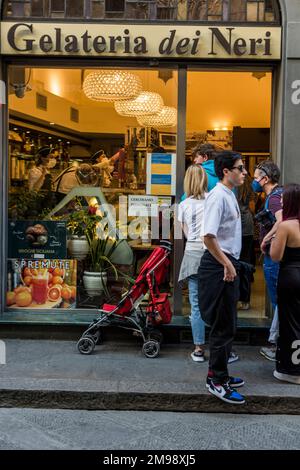 Florence, Italy - April, 14, 2022: People online to buy gelato, Gelateria dei Neri Stock Photo