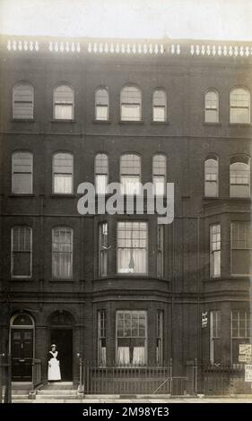 A Housekeeper - West Central London Frontage of a large Terraced house, possibly on a Grand Square, Row or Street. Stock Photo