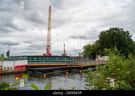 Harefield, London Borough of Hillingdon, UK. 30th July, 2022. HS2 works next to the Grand Union Canal in Harefield. HS2 have chopped down numerous trees in the area of the High Speed Rail link. Environmentalists have concerns about the HS2 works and the impact it is having upon some of the drinking water in the area. Credit: Maureen McLean/Alamy Stock Photo