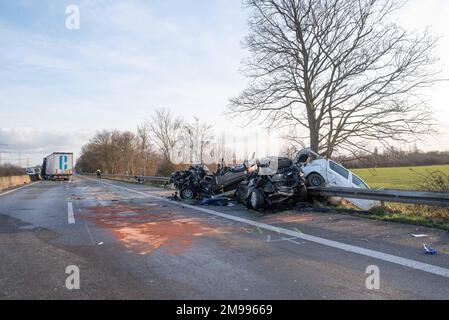 Cologne, Germany. 17th Jan, 2023. Several badly damaged vehicles are parked on the A57 near Cologne. Four men were injured in the rear-end collision at the end of a traffic jam on Tuesday. A tractor-trailer collided from behind around noon and pushed three other trucks and a car into each other, a police spokesman said. (to dpa 'Truck hits end of traffic jam - four injured in five vehicles') Credit: Vincent Kempf/dpa/Alamy Live News Stock Photo