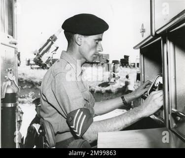 Launcher Control Assistant, Sgt W. Lewis, of the 32nd Guided Weapons Regiment of the Royal Artillery at Ty Croes, North Wales, checks the electronics during training with the English Electric Thunderbird surface-to-air guided missile, 16 July 1961. Stock Photo