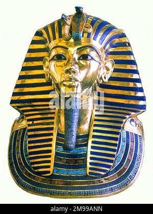 The famous mask of Pharoah TUTANKHAMUN, ruler of the 18th Dynasty of Egypt 1361 - 1352 BC, (Egyptian Museum, Cairo), made of solid gold, with inlaid glass and lapis lazuli. Stock Photo