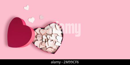 Open pink heart shaped gift box with hearts on pink background. Design for Valentine's Day. Stock Photo