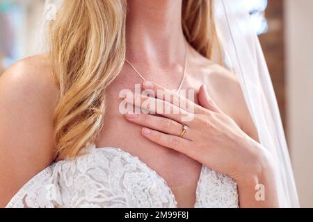 Close Up Of Bride In Bridal Store Trying On Wedding Dress Stock Photo