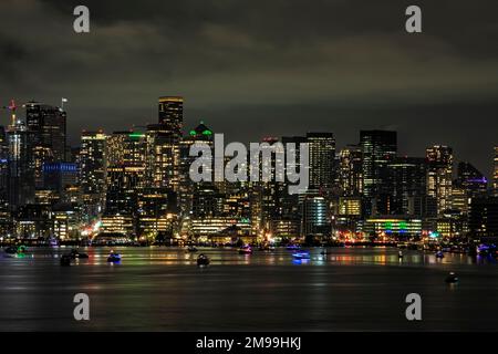 WA22916-00...WASHINGTON - Night view of Seattle and from Gas Works Park on the shores of Lake Union with private boats waiting for the 2023 fireworks Stock Photo