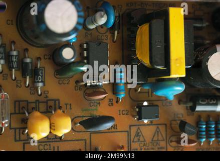 Analog electronic background. Electronic circuit board. Basic electronic circuit components on Printed Circuit Board (PCB). Stock Photo