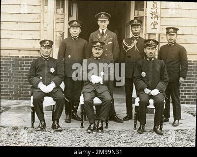 Group of High Naval Staff Officers from the Admiralty including Rear Admiral Tajiri and Captain The Master of Sempill. William Francis Forbes-Sempill, 19th Lord Sempill AFC, AFRAeS (1893-1965) was a Scottish peer and record-breaking air pioneer who was later shown to have passed secret information to the Imperial Japanese military before the Second World War. In 1921, Sempill led an official military mission to Japan that showcased the latest British aircraft. In subsequent years he continued to aid the Imperial Japanese Navy in developing its Navy Air Service and began giving military secre Stock Photo