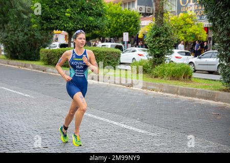 Alanya, Turkey, 16.10.2022: Women athlete from Hungary runs a marathon through the streets of the city of Alanya in Turkey. 2022 Europe Triathlon Cup Stock Photo