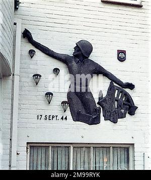 During Operation Market Garden in September 1944 this area was taken by the 508th Parachute Infantry Regiment of the US 82nd Airborne Division. The figure on the wall is a Memorial to that Division. The hotel had been used for almost four years by the Germans as an HQ and then as a parachute training school. They also used the Klooster Nebo, the large Catholic Seminary across the road, both of which were taken over by the advancing Allies' war correspondents and photographers who arrived by glider. Guards Armoured Division Officers moved into the hotel, to be followed by 82nd Airborne staff. Stock Photo