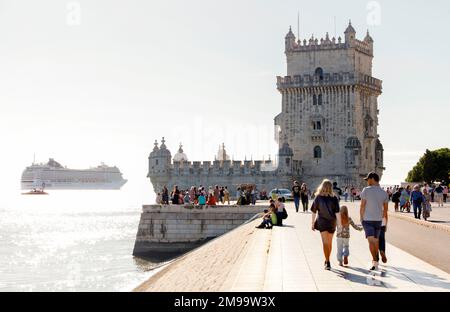 A cruise ship sails on the River Tagus past the Tower of Belem, Lisbon, Portugal Stock Photo