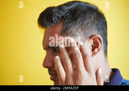 hair loss concept with man checking his hair  Stock Photo