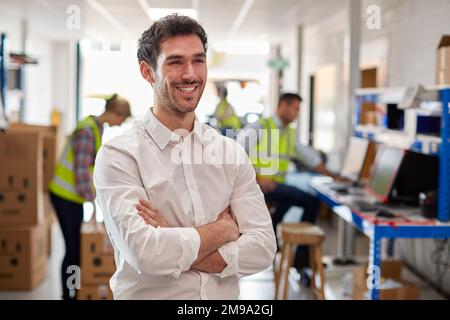 Portrait Of Male Manager In Logistics Distribution Warehouse Stock Photo