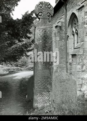 A 10th century Celtic cross in the churchyard of the Norman Church of St Brynach, Nevern, Pembrokeshire, South Wales. Stock Photo