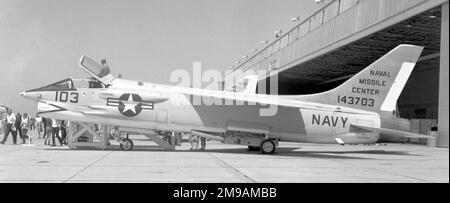 United States Navy - Vought DF-8F Crusader 143703 (call-sign '103'), target tug, of the Pacific Missile Centre, at Point Mugu Naval Air station, on 15 May 1965. At least forty-five F-8A's were modified to serve as target-director aircraft; designated DF-8F. In practice the DF-8F pilot spooled out a target on a cable from the port wing, which was towed at a safe distance behind. While in tow, fighters would practice gun-and missile-firing exercises, shooting at the target in tow. After the practice, the pilot retrieved the target, or empty cable. 143703 is currently aboard the USS Hornet Muse Stock Photo