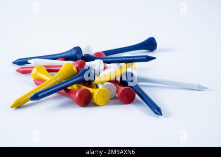 sustainable environmentally friendly bamboo  professional golf tees in various colors bio degradeable isolated on a white background Stock Photo