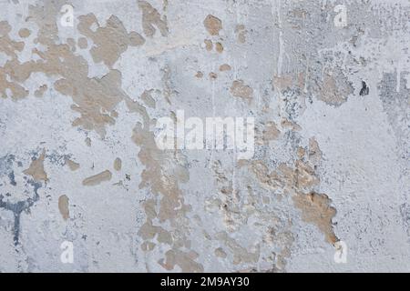 White grunge old concrete stucco wall texture background. Abstract weathered peeled plaster wall with falling off flakes of paint background Stock Photo