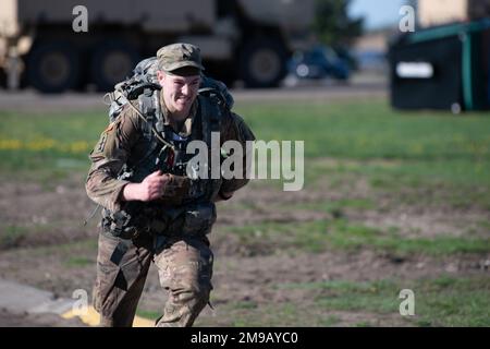 Sgt. Josiah Bell of Rochester, Minnesota, an Infantryman with the Wisconsin National Guard’s B Company, 1st Battalion, 128th Infantry Regiment sprints to the end of the 12-mile ruck on May 15, 2022 during the Region IV Best Warrior Competition. He is one of twelve National Guard Soldiers competing in the Region IV Best Warrior Competition May 11-15, 2022, at Camp Ripley, Minnesota. The annual competition tests the military skills, physical strength and endurance of the top Soldiers and noncommissioned officers from the Minnesota, Wisconsin, Iowa, Illinois, Michigan, Indiana, and Ohio National Stock Photo