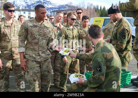 Soldiers from 4th Brigade Combat Team, 25th Infantry Division receive their roster numbers before attempting the Norwegian March during Exercise Swift Response on May 15, 2022 at Setermoen, Norway. Exercise Swift Response 2022 is an annual multinational training exercise, which takes place in Eastern Europe, the Arctic High North, Baltics and Balkans from May2-20. The purpose of the exercise is to present combat credible Army forces in Europe and Africa, and enhance readiness by building airborne interoperability with Allies and Partners and the integration of joint service partnership. Stock Photo