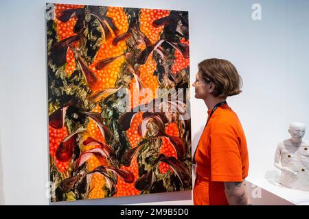 London, UK.  17 January 2023. A woman views 'Threefold', 2018, by Andy Harper (James Freeman Gallery) at the press view of London Art Fair at the Business Design Centre in Islington.  Works by artists represented by over 100 modern and contemporary galleries are on show 18 to 22 January.  Credit: Stephen Chung / Alamy Live News Stock Photo