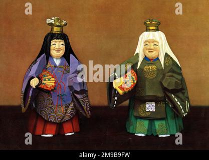 Japanese Nara Dolls - wooden carved dolls used for decorative purposes at a festival of the Kasuga shrine at the time of Emperor Sutoku in 1137. Seen here are dolls representing figures in the Noh play, Tsurukame (tsuru meaning stork, kame meaning tortoise, both representing longevity). Stock Photo