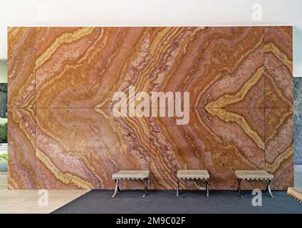 Barcelona, Spain, May. 2018: Interior of the Barcelona Pavilion feature granite wall and Barcelona chairs Stock Photo