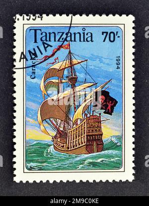 Cancelled postage stamp printed by Tanzania, that shows Carrack sailing ship, circa 1991. Stock Photo