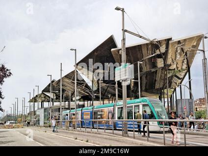 Barcelona, Spain - May 2018:Mirror reflection in Mercat de Les Glories ancient Enchant. Modern architecture view over a tram Stock Photo