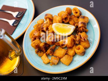 Spanish seafood dish battered fried baby squid Stock Photo