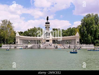 Madrid, Spain - May 2018: A picture of the El Retiro Lake and the Monument to Alfonso XII in the El Retiro Park Stock Photo