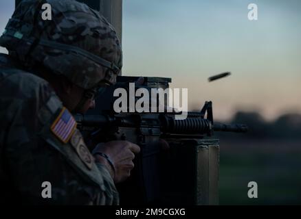 A U.S. Army Soldier assigned to the NCO Academy at Camp Normandy, waits for  his baseball to be signed by Clark, the Chicago Cubs mascot, at  Grafenwoehr, Germany, Dec. 11, 2018. The