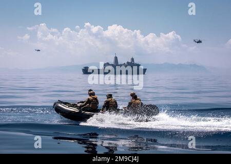 220516-N-PC065-1309   SKYROS ISLAND, Greece (May 16, 2022) – U.S. Marines attached to the 22nd Marine Expeditionary Unit return to the San Antonio-class amphibious transport dock ship USS Arlington (LPD 24) in a combat rubber raiding craft after joint training with Hellenic Armed Forces off the coast of Skyros Island, Greece, May 16, 2022. Arlington, with embarked 22nd Marine Expeditionary Unit, is participating in exercise Alexander the Great 2022 under the command and control of Task Force 61/2. Alexander the Great 22 strengthens interoperability and force readiness between the U.S., Greece, Stock Photo