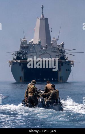 220516-N-PC065-1370   SKYROS ISLAND, Greece (May 16, 2022) – U.S. Marines attached to the 22nd Marine Expeditionary Unit return to the San Antonio-class amphibious transport dock ship USS Arlington (LPD 24) in a combat rubber raiding craft after joint training with Hellenic Armed Forces off the coast of Skyros Island, Greece, May 16, 2022. Arlington, with embarked 22nd Marine Expeditionary Unit, is participating in exercise Alexander the Great 2022 under the command and control of Task Force 61/2. Alexander the Great 22 strengthens interoperability and force readiness between the U.S., Greece, Stock Photo