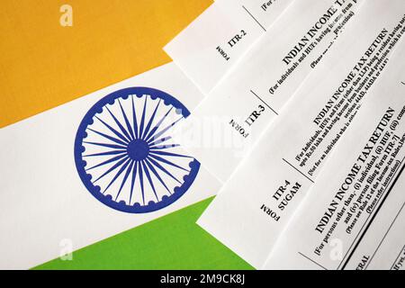 KYIV, UKRAINE - MAY 4, 2022 Indian income tax return blank forms on indian country flag close up. Annual tax report concept Stock Photo